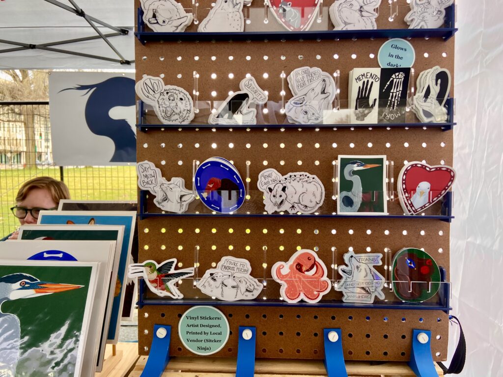 various stickers from the angry animal series of seven herons studio  at the Portland Saturday market